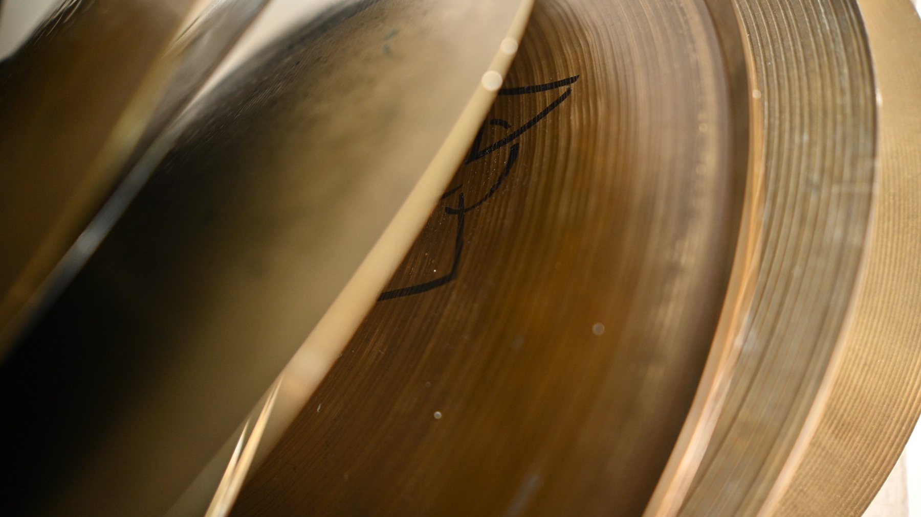 Close detail of repaired and stored cymbals